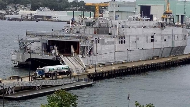 Image of a ship next to a Pool Water truck